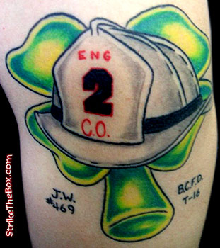 irish firefighter tattoo with leather helmet